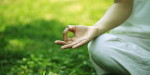 young woman doing yoga,hand close-up